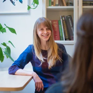 Dr. Nyrose talking with patient in her office